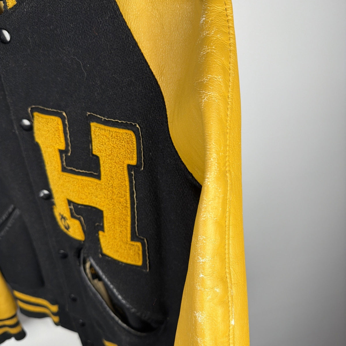 Vintage 1940s-50s black wool and gold leather varsity jacket, H patch
