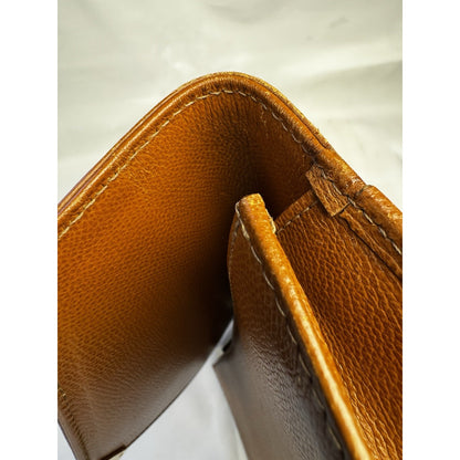 Vintage 1990s Yves Saint Laurent brown leather envelope clutch wrist strap
