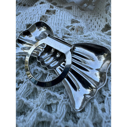 Silver bow scarf clip (1970s)