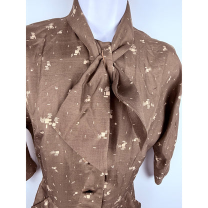Vintage 1950s geometric button front day dress with neck bow and pockets!