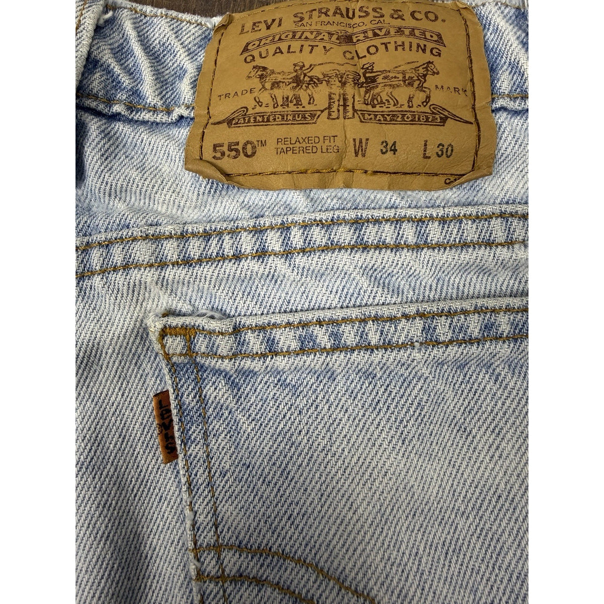 Vintage 90s Levi's 550 Orange Tab tapered jeans, light wash, 34x30