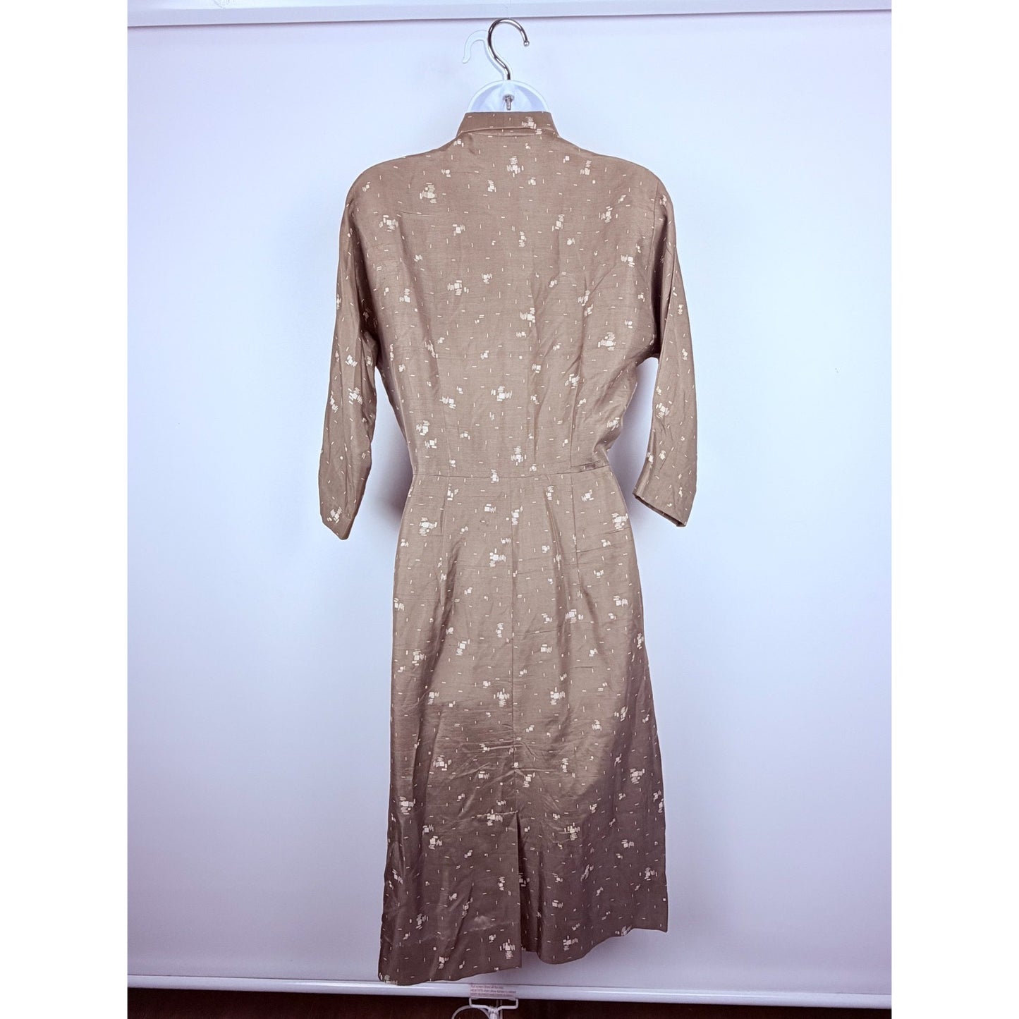 Vintage 1950s geometric button front day dress with neck bow and pockets!