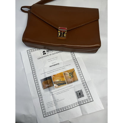 Vintage 1990s Yves Saint Laurent brown leather envelope clutch wrist strap