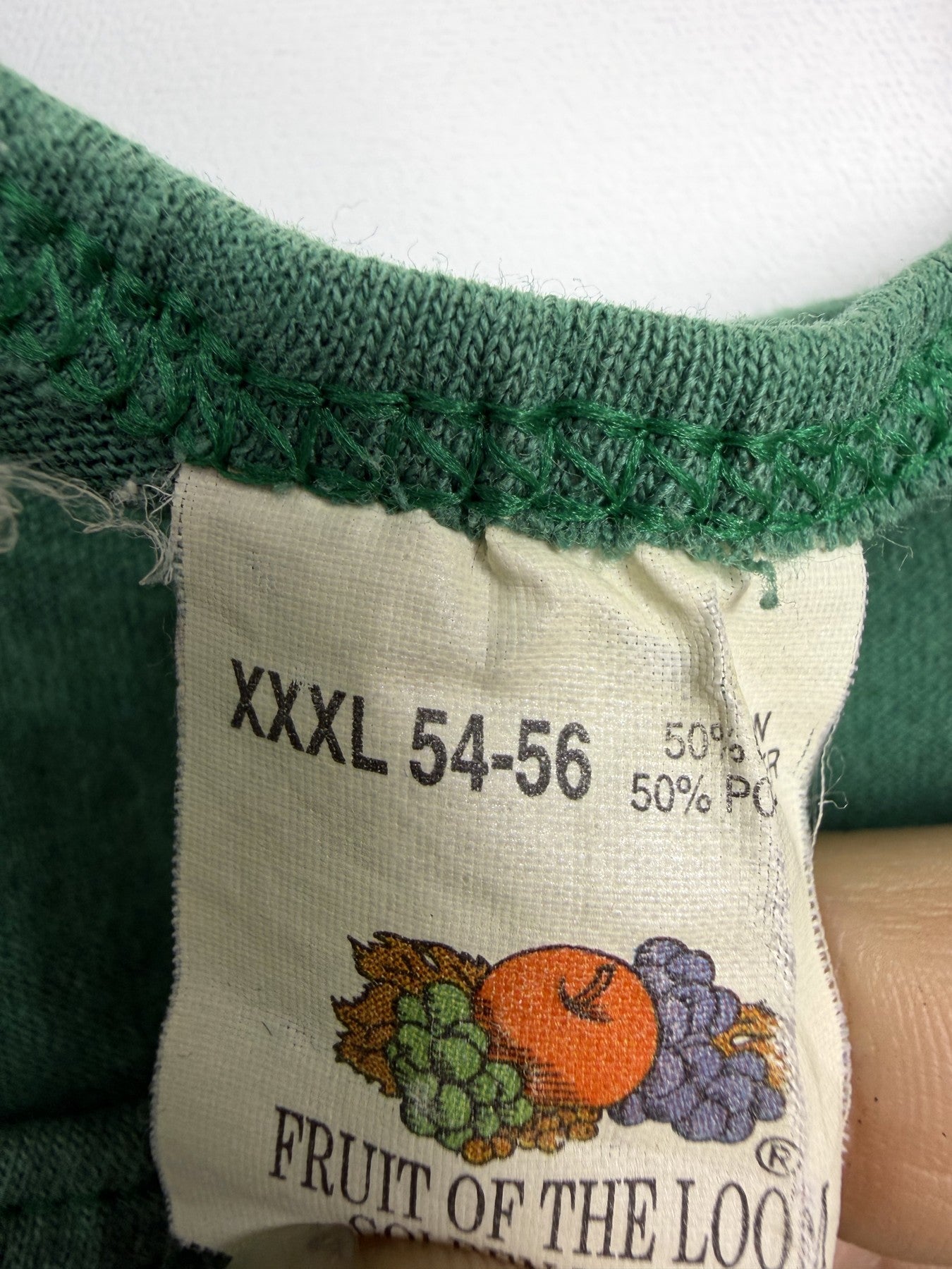 Green Time to Waste tank top — burn hole detail